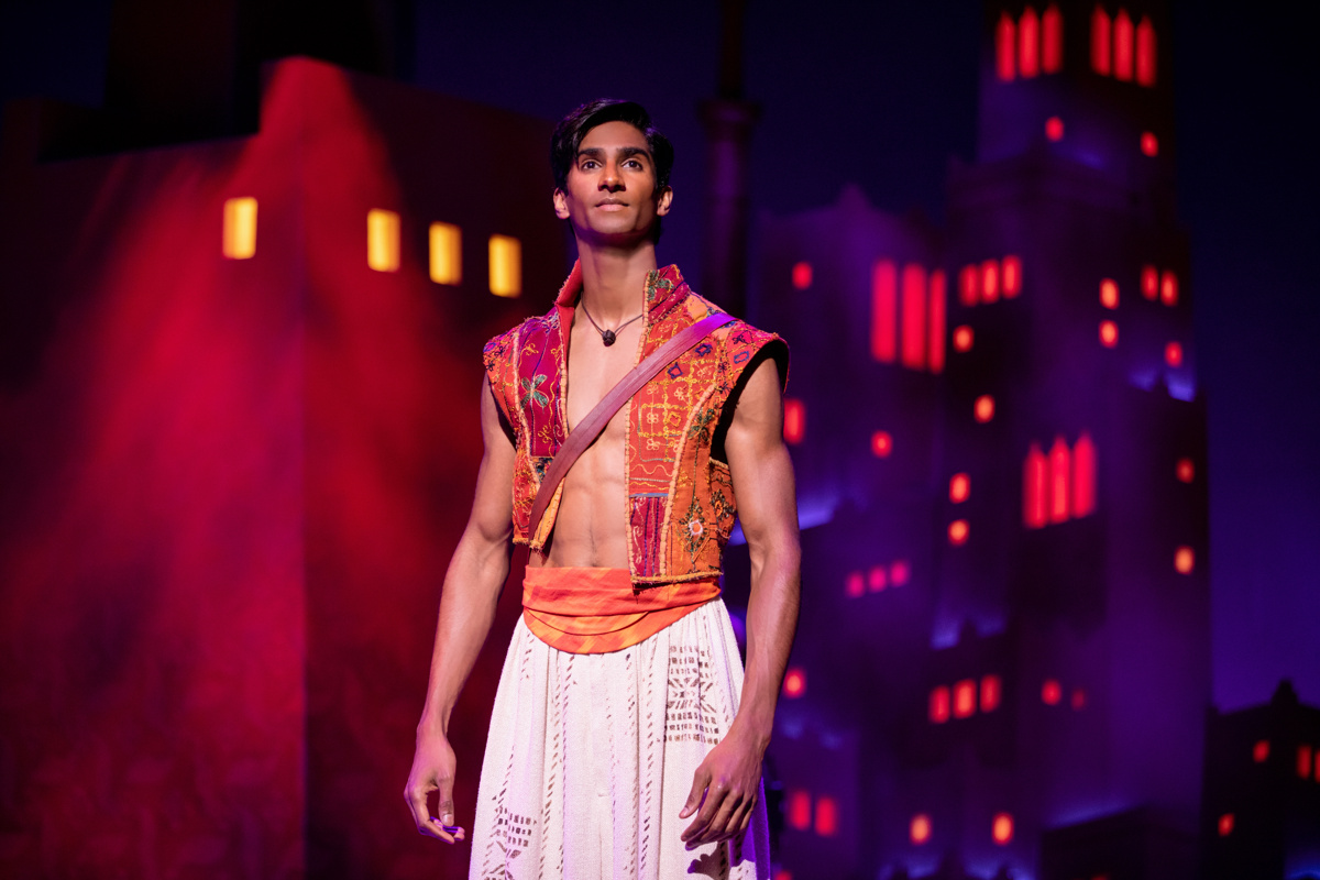 Michael Maliakel as Aladdin stands tall while looking out