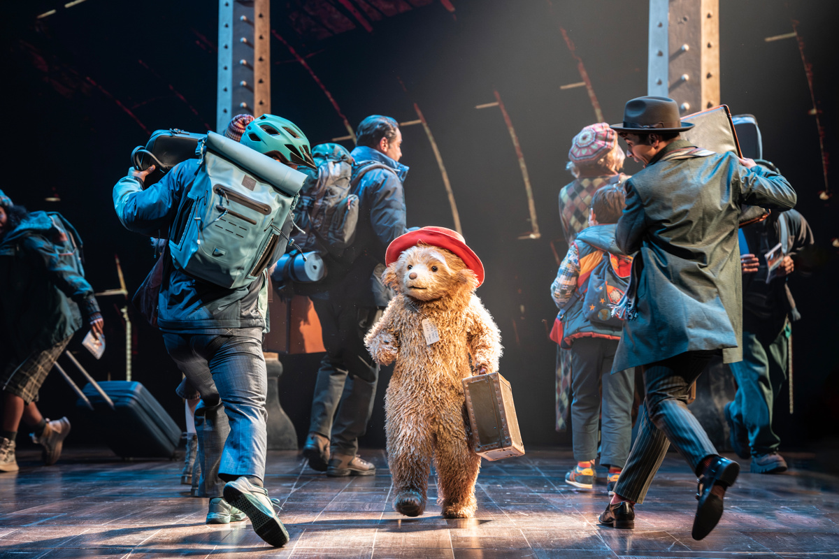 Paddington navigates a crowded train station
