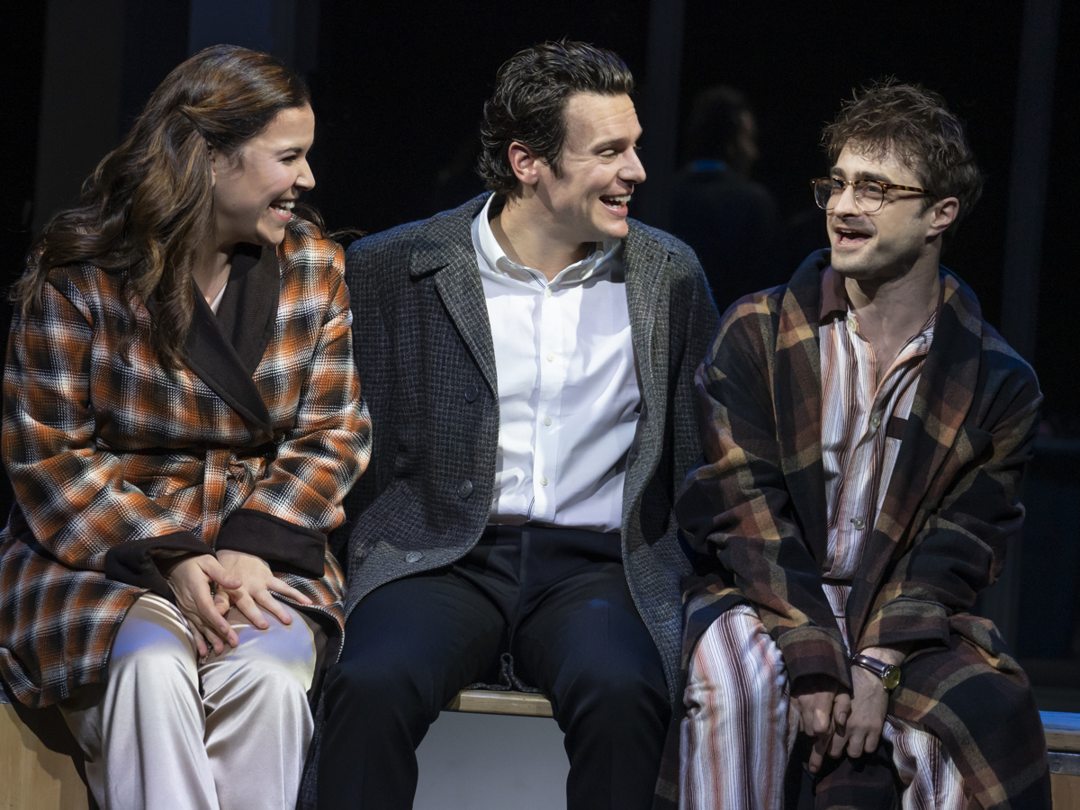 Lindsay Mendez as Mary, Jonathan Groff as Franklin and Daniel Radcliffe as Charley sit together in Merrily We Roll Along
