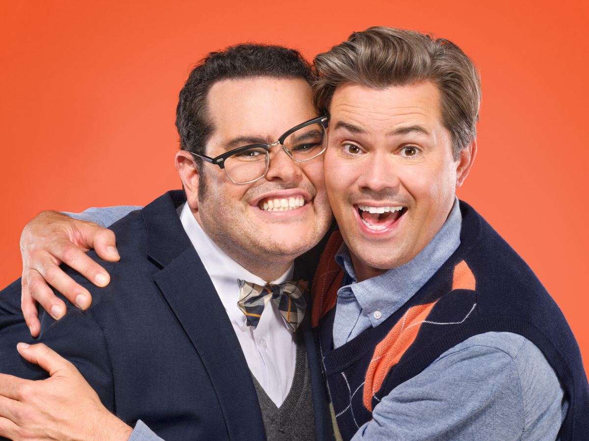 Josh Gad and Andrew Rannells hugging and smiling