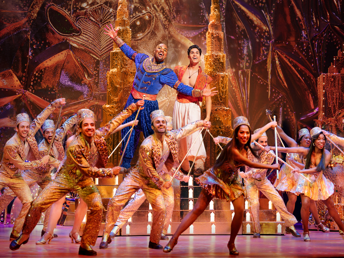 Genie and Aladdin perform in a spectacular musical number