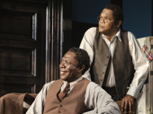 Michael Potts as Wining Boy and Samuel L. Jackson as Doaker Charles in The Piano Lesson.