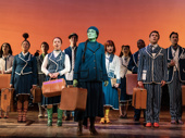 Alyssa Fox as Elphaba and the cast of Wicked.
