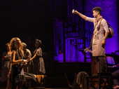 Jordan Fisher as Orpheus and the cast of Hadestown.