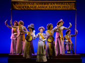 Jenn Colella as Carrie Chapman Catt in and the cast of Suffs.