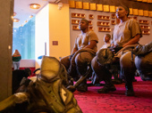 Bongi Duma, Sbu Ngema (center) and original cast member Lindiwe Dlamini (right) await their cues in their artfully tattered hyena boiler suits.