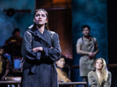 Myra Molloy as Eurydice and the cast of Hadestown.
