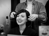 Liana Hunt gets her wig secured to play Sandra in The Play That Goes Wrong. However, Hunt anticipates that it won’t stay in place for long. “I literally get rag-dolled out of the window and then slammed into the wall three times and then my neck's flopping. I come back looking a little tousled.”