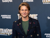 Drag Me to Dinner’s David Burtka eats on the Titanique opening night carpet.