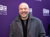 Tony winner Danny Burstein smiles warmly for the opening night carpet of The Balusters.
