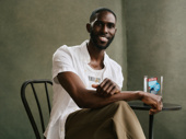 Hadestown cast member Malcolm Armwood poses with the Favorite Long-Running Show award.