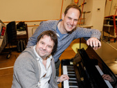 Groundhog Day's music director Christopher Nightingale and orchestrator David Holcenberg pose by the piano.