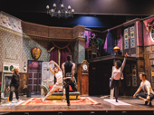 The cast of The Play That Goes Wrong stretches it out before a performance.
